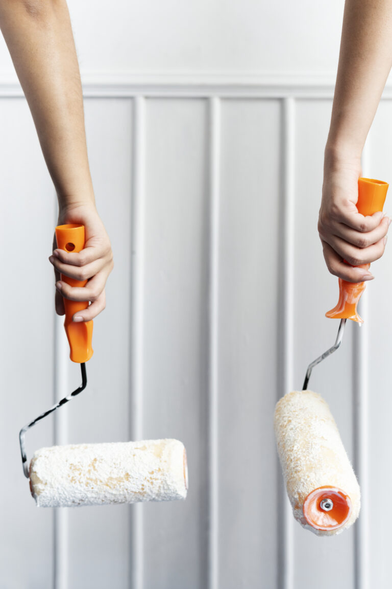Exterior-Painting-Two hands painting the wall