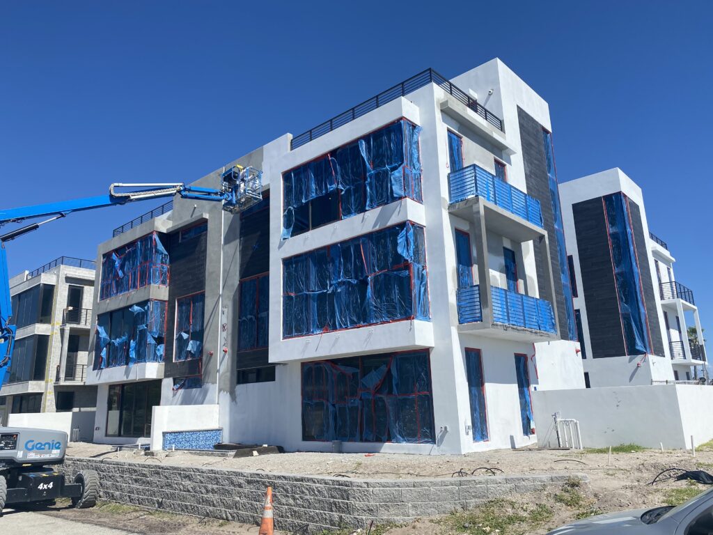 white building and blue with painter 2